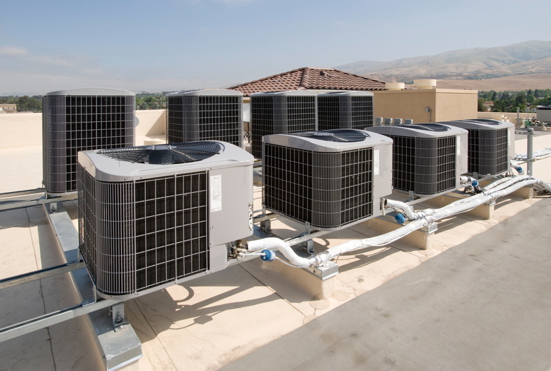 Routine maintenance of commercial air conditioning units to ensure consistent cooling efficiency